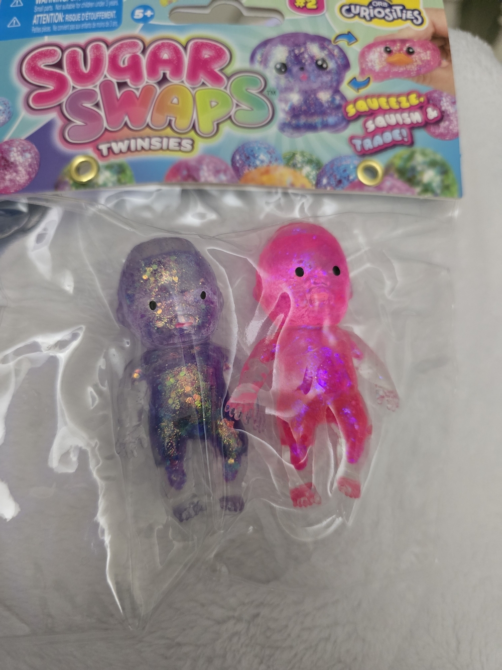 Orb Curiosities Sugar Swap Baby Twinsies Glitter Squish - Purple & Pink
